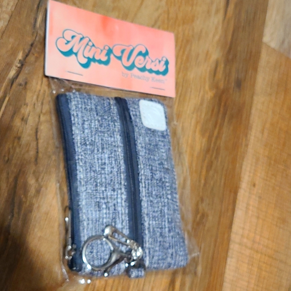 Cute Multi Purpose Bag With Key Chain Attachment.